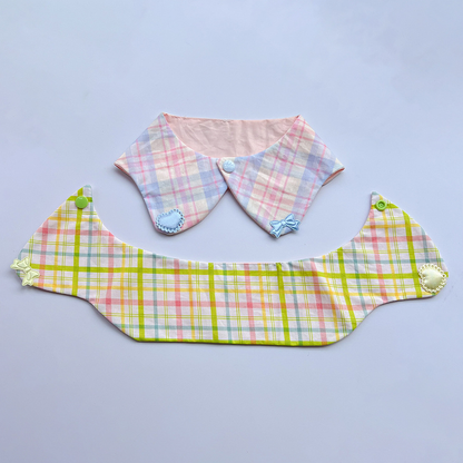 Blue-accented plaid Pet Neckwear beside an opened yellow-accented piece showing the band and snap ends.