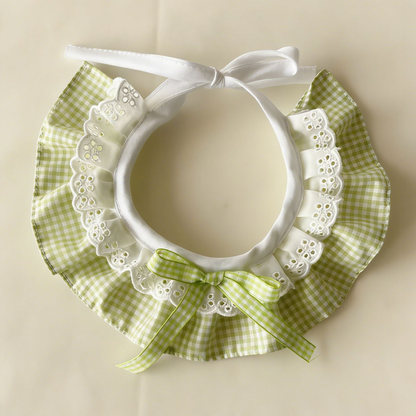 Green gingham Pet Neckwear with white lace-look ruffles, matching bow, and white ties.