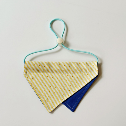 Yellow / Blue Pet Neckwear with diagonal stripes, overlapping triangular panels and a turquoise neck loop.