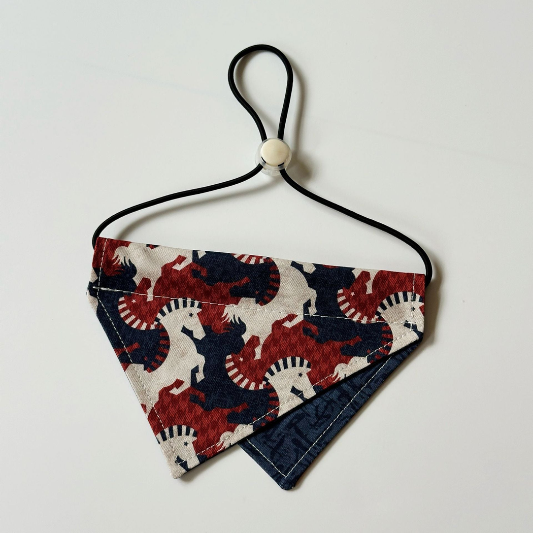 Navy Pet Neckwear with red and cream horse silhouettes, a triangular panel, and a black cord loop