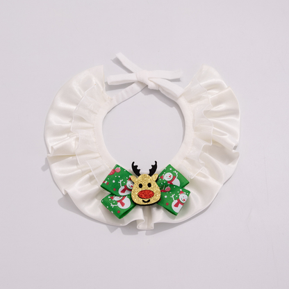 Reindeer pet neckwear with white ruffles, a green snowman-patterned bow, and a glittery reindeer face.