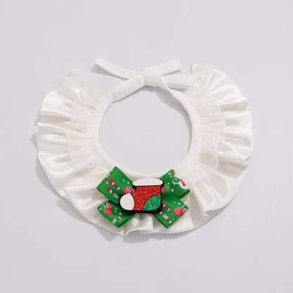 Stocking pet neckwear with white ruffles, a green patterned bow, and a glittery red and green stocking accent.