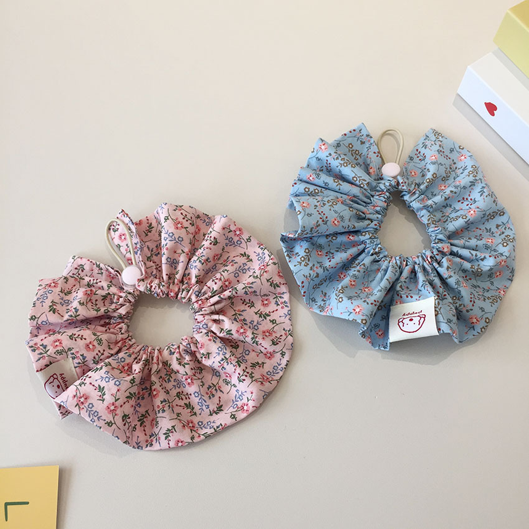 Light Pink and Light Blue floral ruffled pet neckwear arranged separately with both cord loops visible.