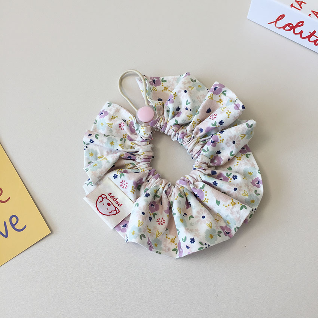 Light Purple floral ruffled Pet Neckwear with a gathered center, loop, and round pale purple disk.