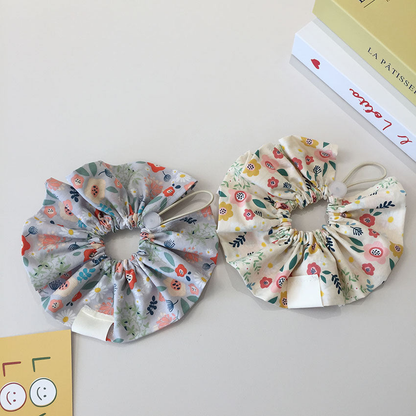 Gray Blue and Ivory floral ruffled pet neckwear with reverse sides and gathered openings visible.