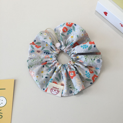 Gray Blue floral ruffled pet neckwear with a gathered opening and loop.