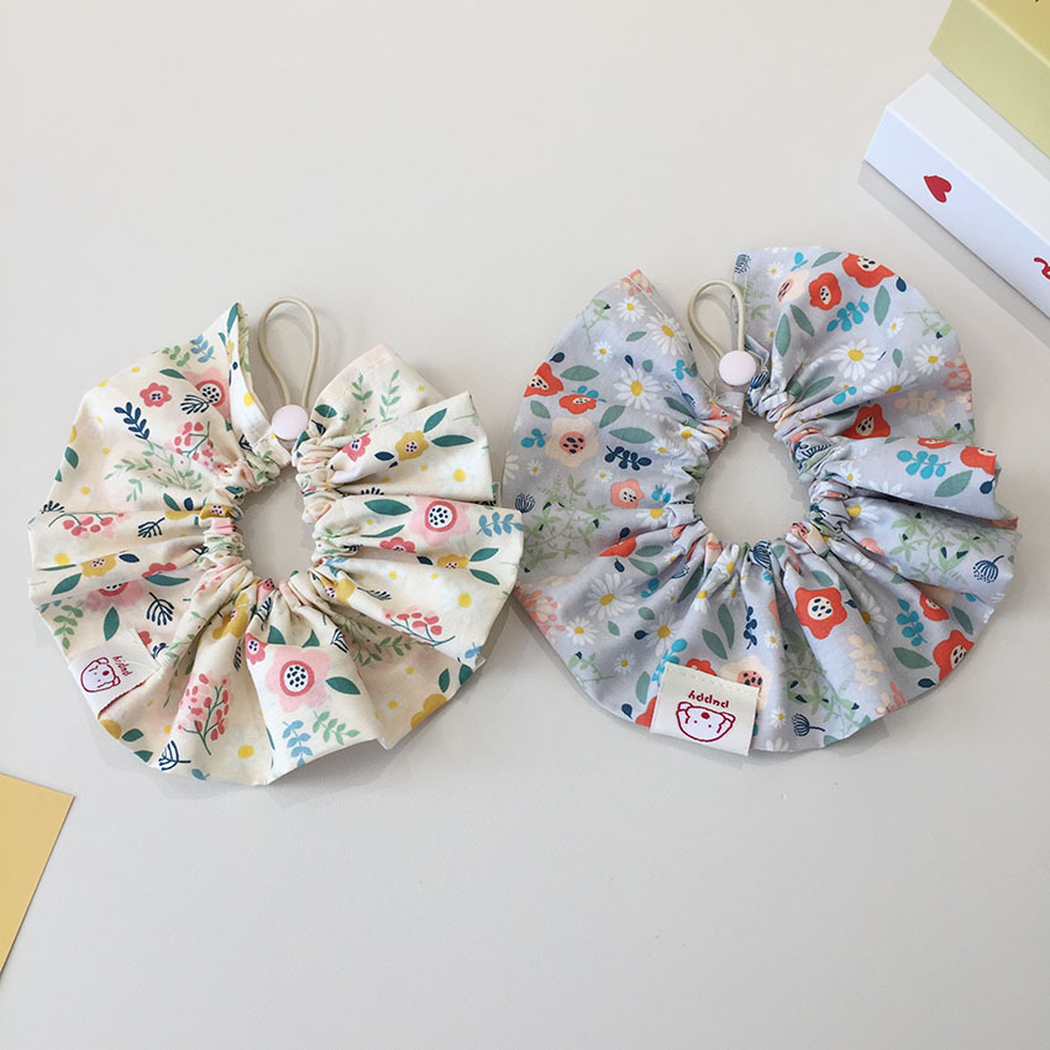 Ivory and Gray Blue floral ruffled pet neckwear displayed side by side.