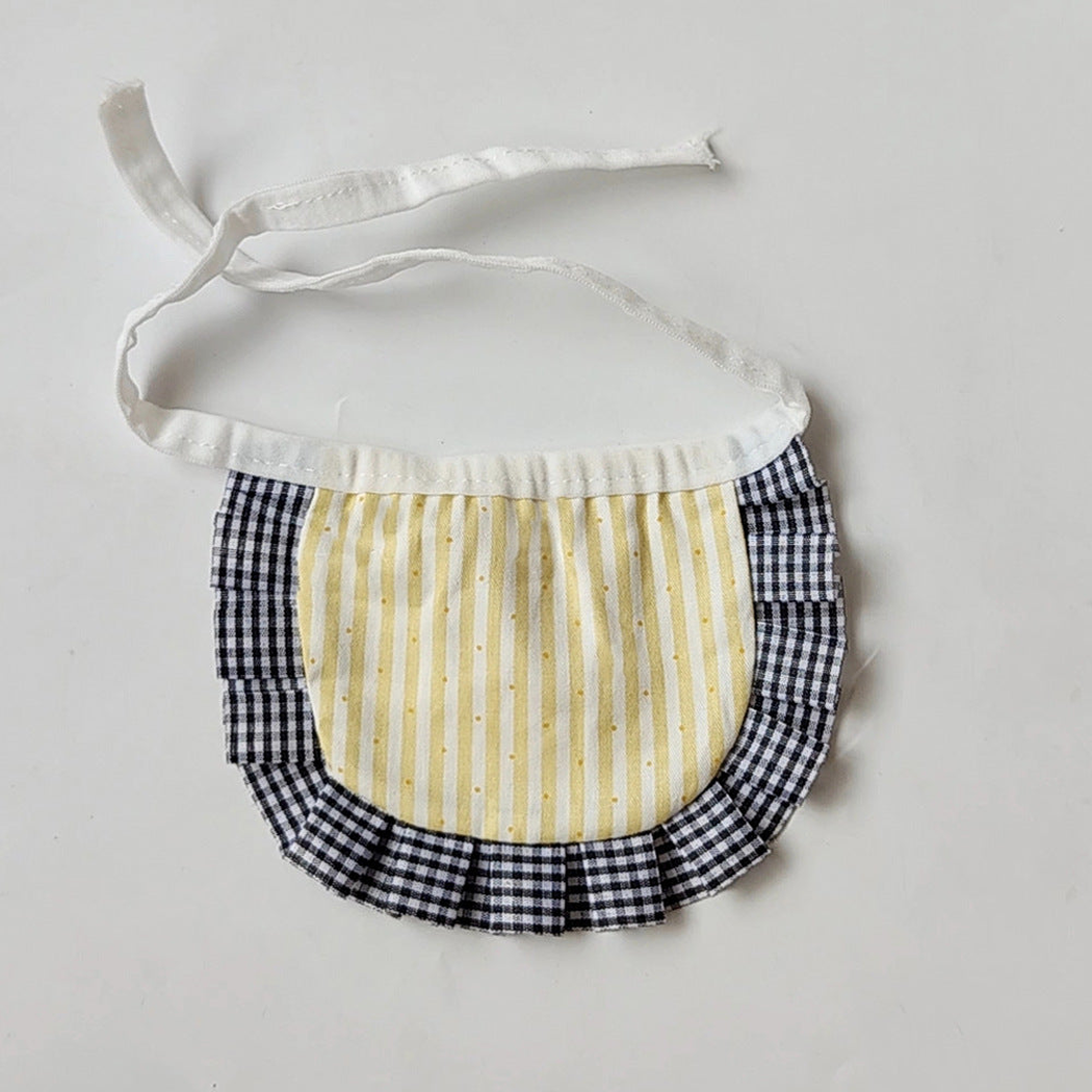 Yellow bib-style Pet Neckwear with vertical stripes, black-and-white gingham ruffles and white tie straps.