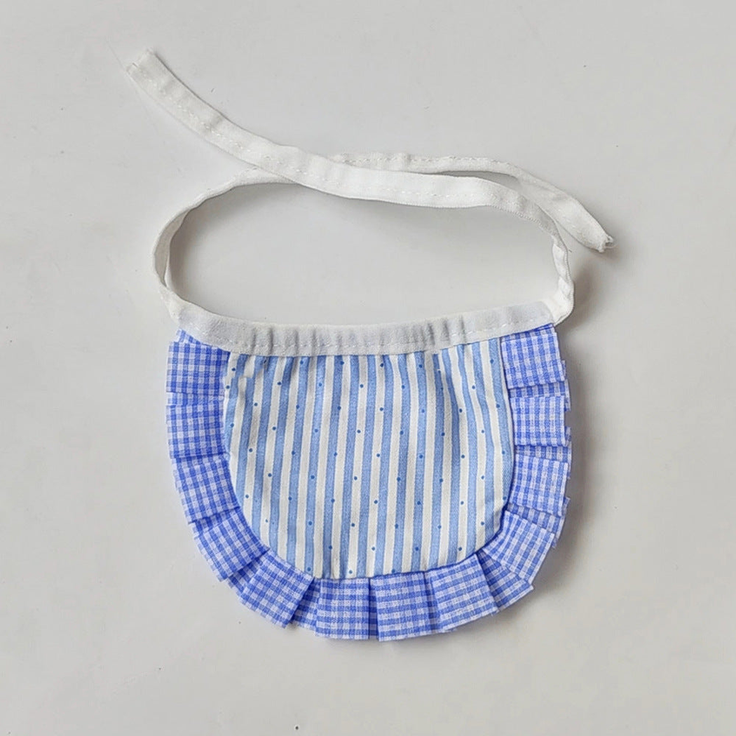 Blue bib-style Pet Neckwear with dotted vertical stripes, gingham ruffles and white tie straps.