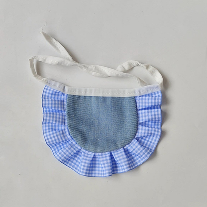 Blue Pet Neckwear with a textured blue center panel, gingham ruffle, and white tie straps.