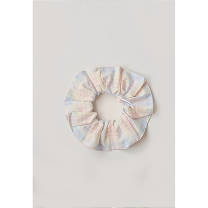 Pastel Plaid Pet Neckwear with a circular gathered ruffle, white loop cord, and pink toggle.