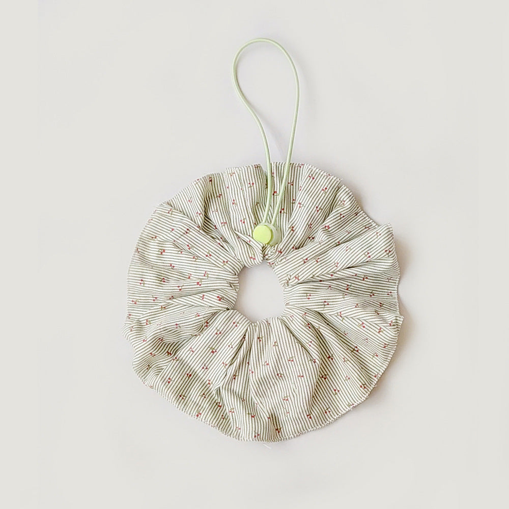 Green ruffled Pet Neckwear with fine stripes, tiny cherry motifs, and a cord loop with a round slider.