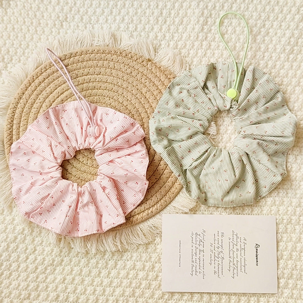 Light Pink and Green ruffled Pet Neckwear with fine stripes, cherry motifs, and cord loops displayed together.