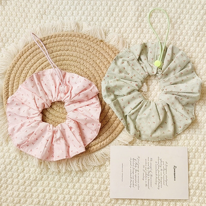 Light Pink and Green ruffled Pet Neckwear with fine stripes, cherry motifs, and cord loops displayed together.