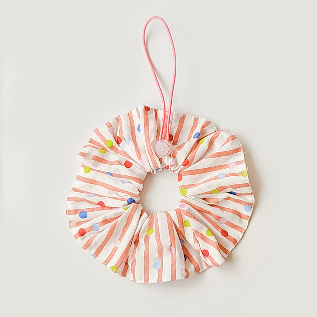 Orange Red ruffled pet neckwear with white stripes, multicolored dots, and a pink loop with round adjuster.
