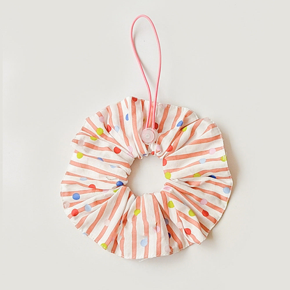 Orange Red ruffled pet neckwear with white stripes, multicolored dots, and a pink loop with round adjuster.