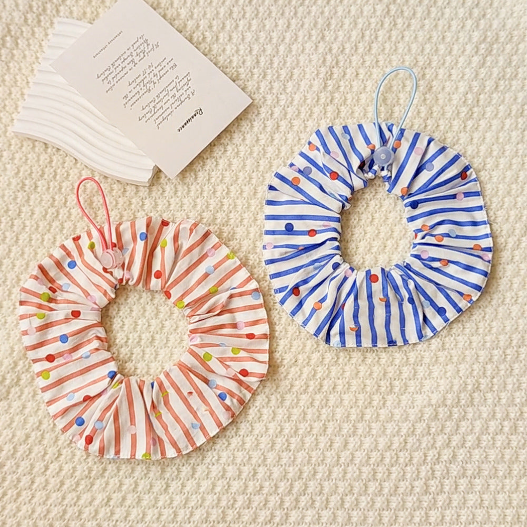 Orange Red and Blue ruffled pet neckwear with stripes and multicolored dots displayed together.