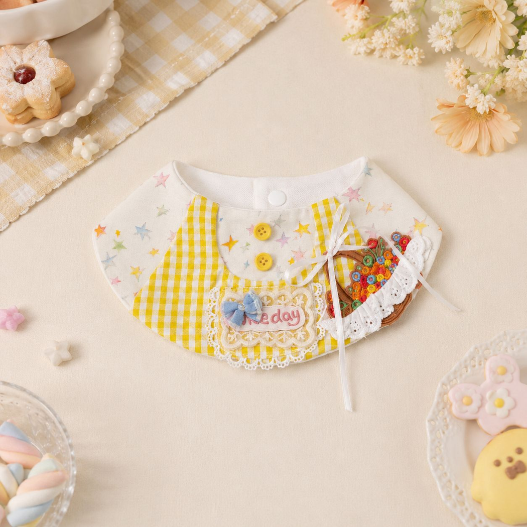 Yellow gingham and pastel star pet neckwear arranged with flowers and sweets, with bows and a flower basket appliqué.