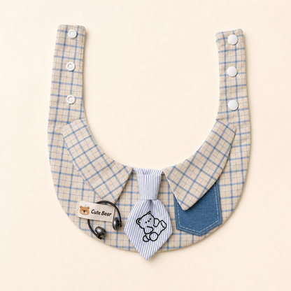 Blue and cream checked pet neckwear laid flat with snap straps, striped bear tie, and blue pocket.