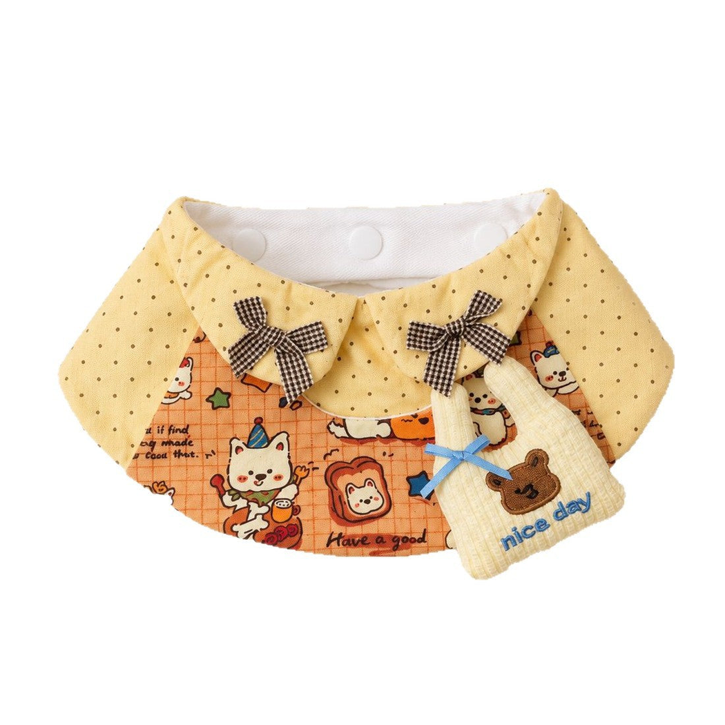 Yellow and orange bib-style Pet Neckwear with polka dots, cartoon animals, checked bows, and a bear bag-shaped ornament.