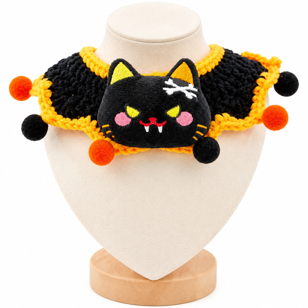 Black and orange cat-face pet neckwear displayed on a mannequin
