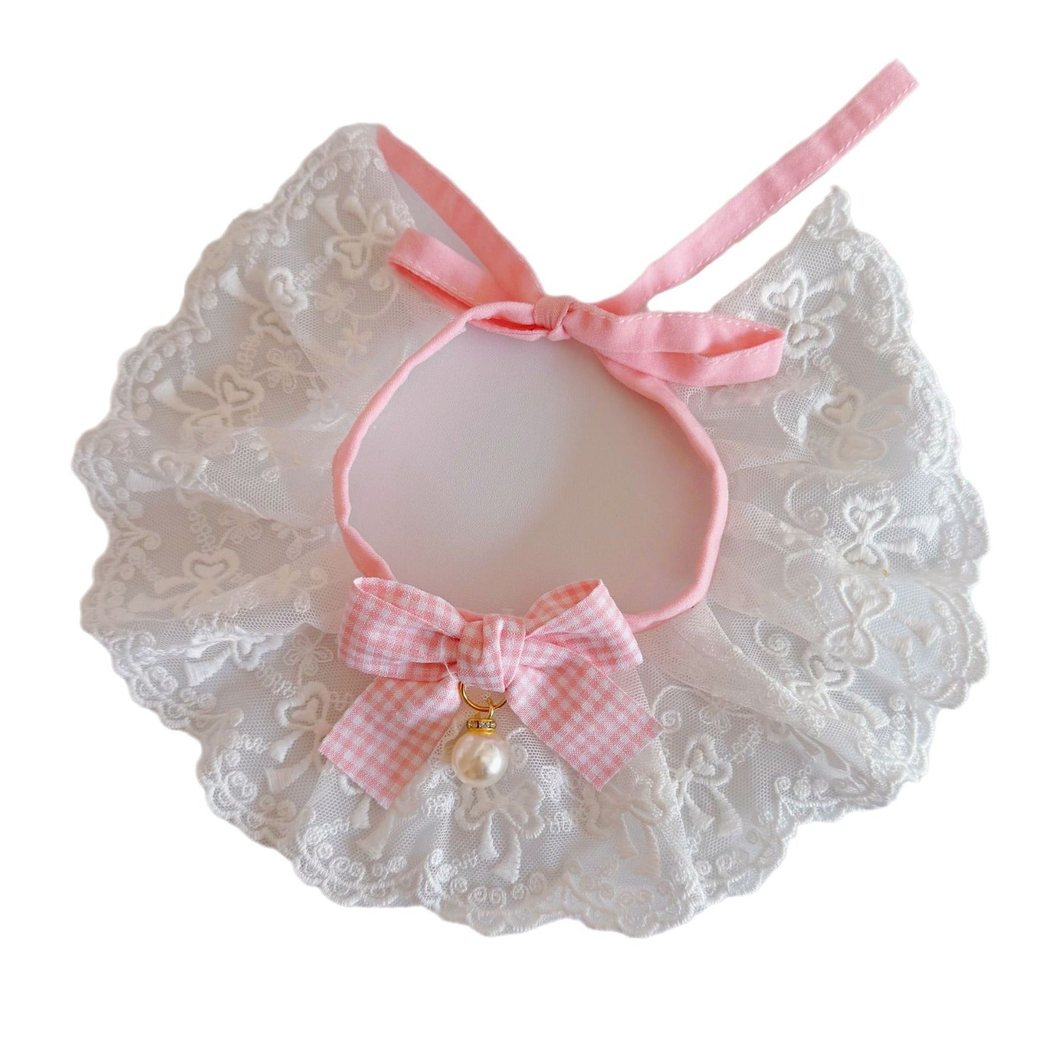Light Pink lace pet neckwear with gingham bow and pearl-like bead on a white background