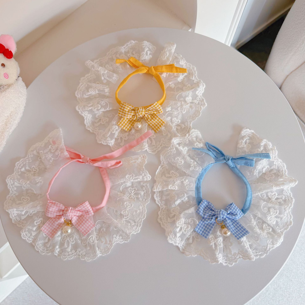Multiple lace pet neckwear styles displayed together