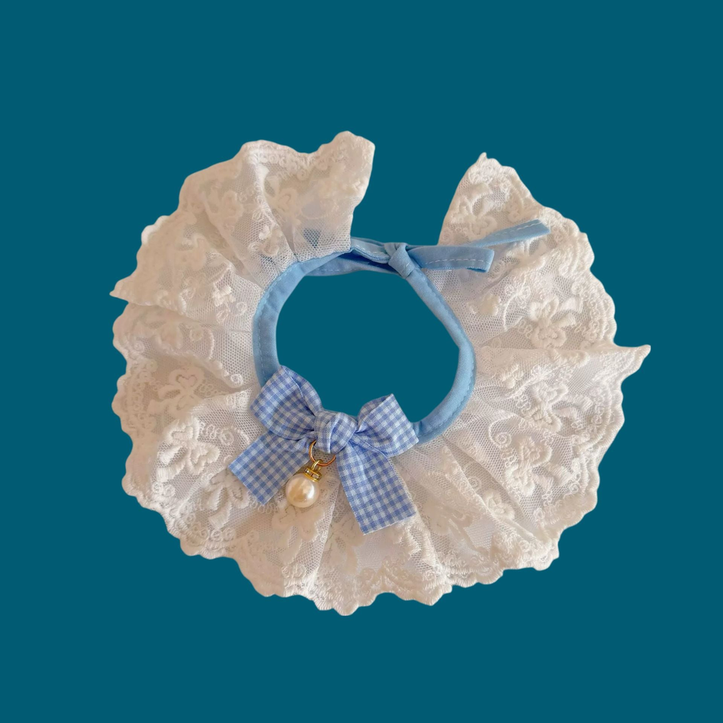 Light Blue and white pet neckwear with floral lace-look ruffles, a checkered bow, and pearl-look ornament