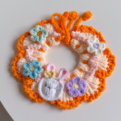 Orange Bunny pet neckwear with a bunny-face ornament and flowers, front view