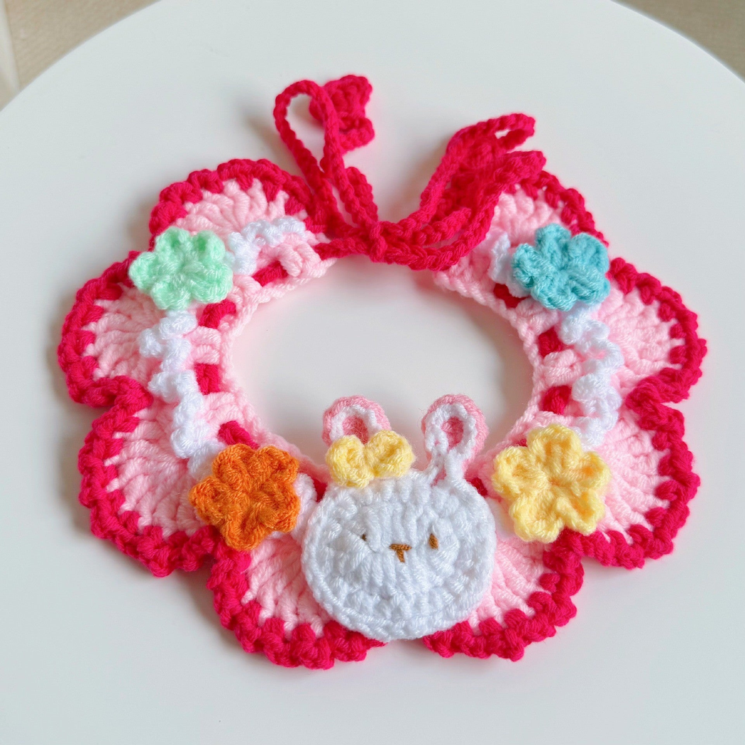Red Bunny pet neckwear with a bunny-face ornament and flowers, front view