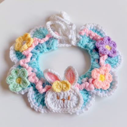 Blue Bunny pet neckwear with a bunny-face ornament and flowers, front view