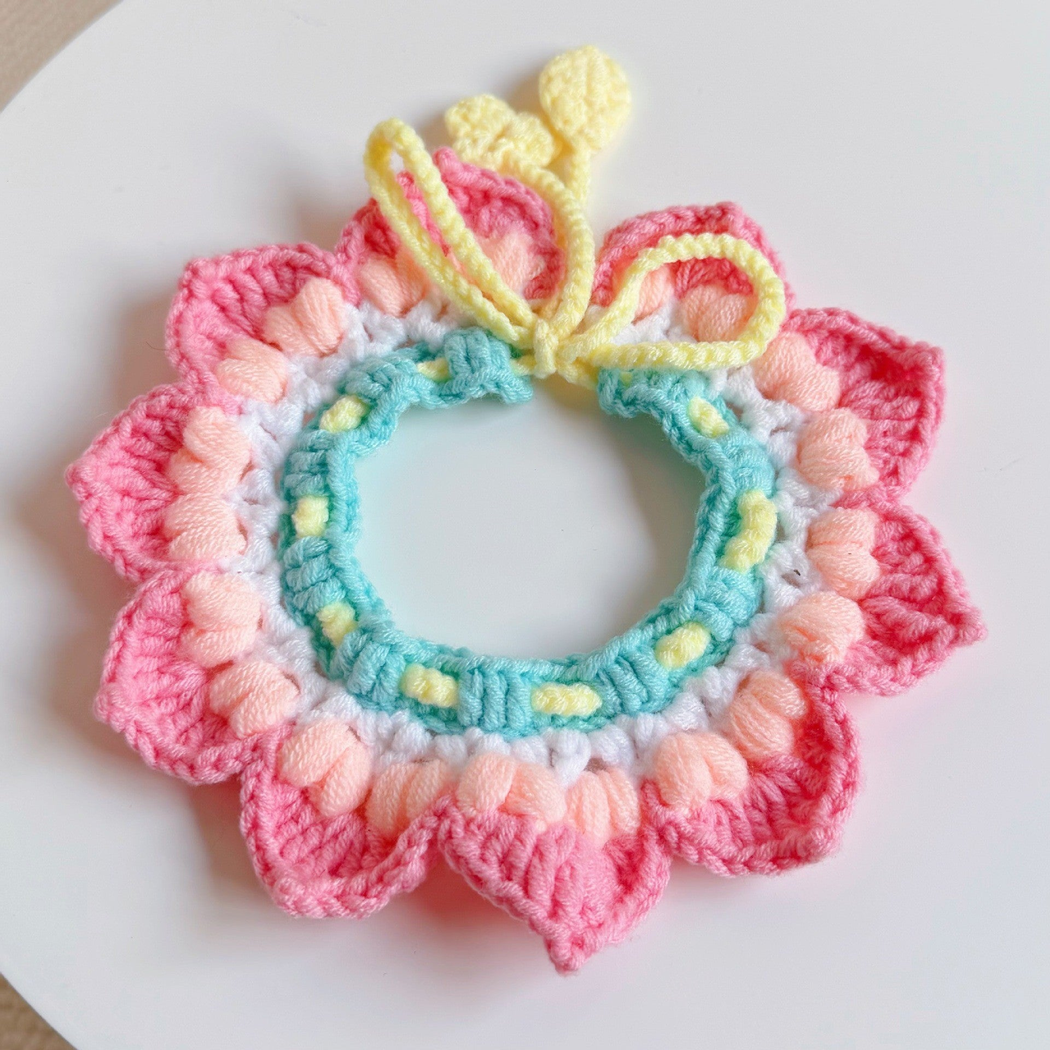 Lotus pet neckwear with layered petals and a mint inner ring, front view
