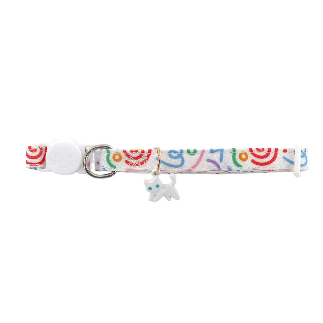 White Cat pet neckwear with a multicolor patterned strap and white cat charm
