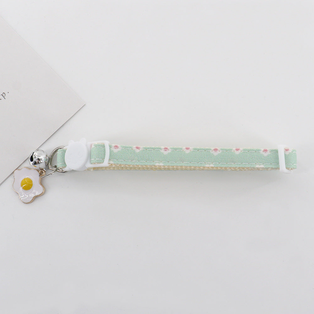 Mint Flowers pet collar with cat-shaped slider, bell, and flower charm