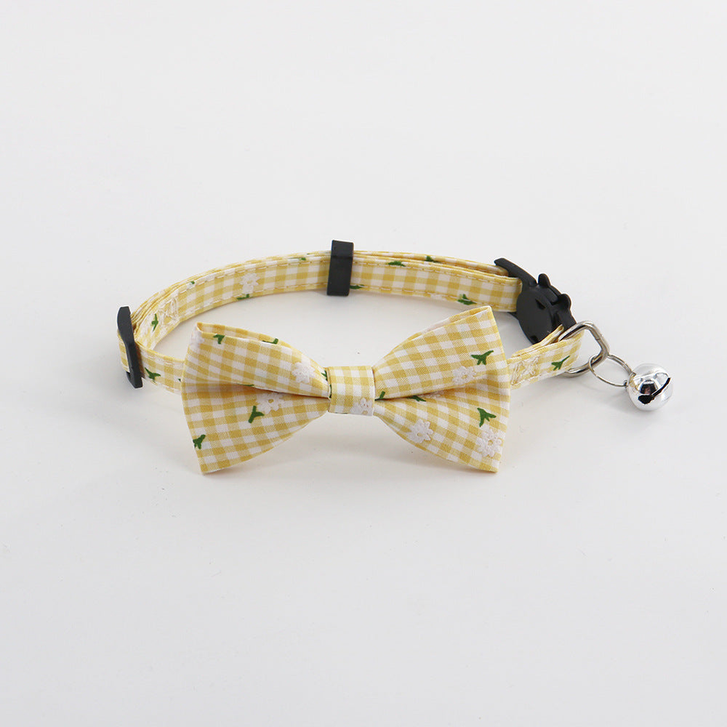 Yellow gingham pet collar with bow and bell, front view