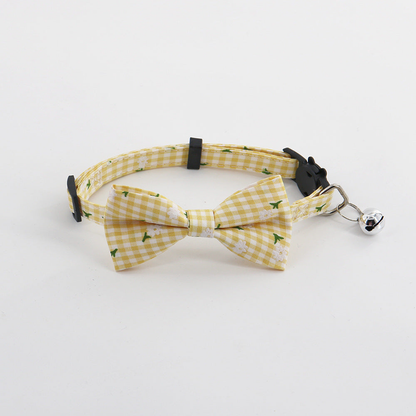 Yellow gingham pet collar with bow and bell, front view