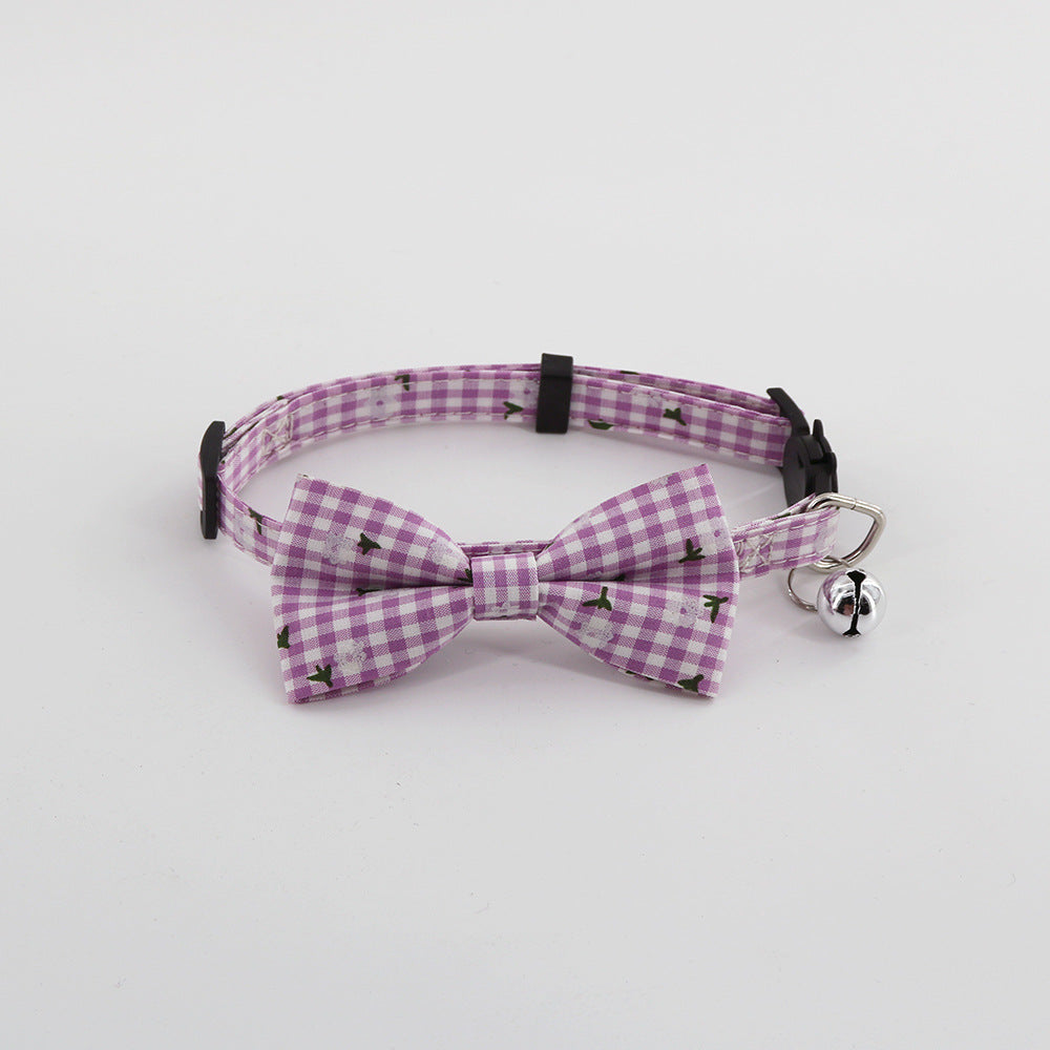 Purple gingham pet collar with bow and bell, front view