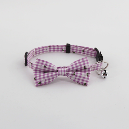 Purple gingham pet collar with bow and bell, front view