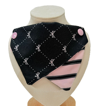 Diamond Dots pet neckwear with a black patterned upper panel and pink striped lower panel, front view