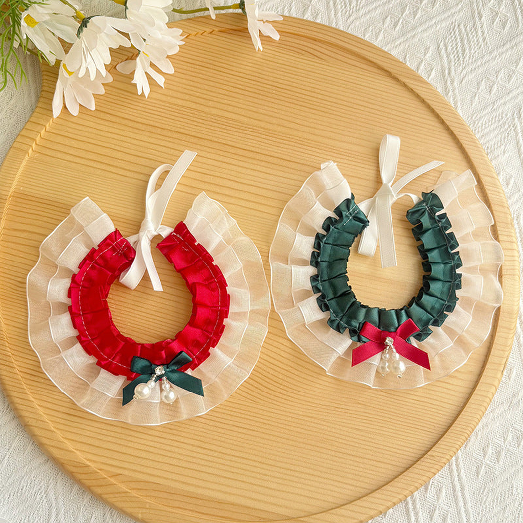 Red and deep teal layered ruffled pet neckwear displayed together