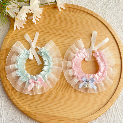 Light blue and light pink layered ruffled pet neckwear displayed together
