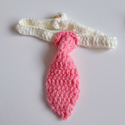 Pink tie-shaped pet neckwear with a white looped strap