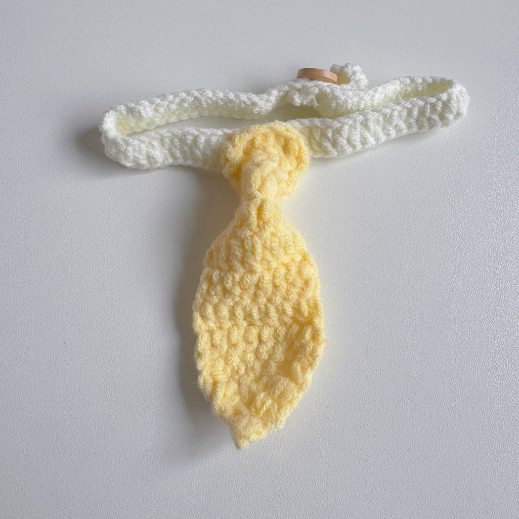 Yellow tie-shaped pet neckwear with a white looped strap