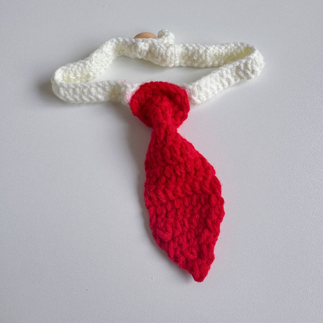 Red tie-shaped pet neckwear with a white looped strap