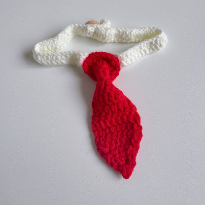 Red tie-shaped pet neckwear with a white looped strap