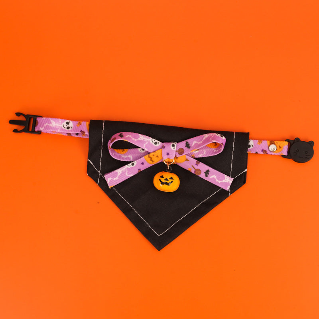 Skull Bats pet neckwear with a purple patterned bow and pumpkin charm