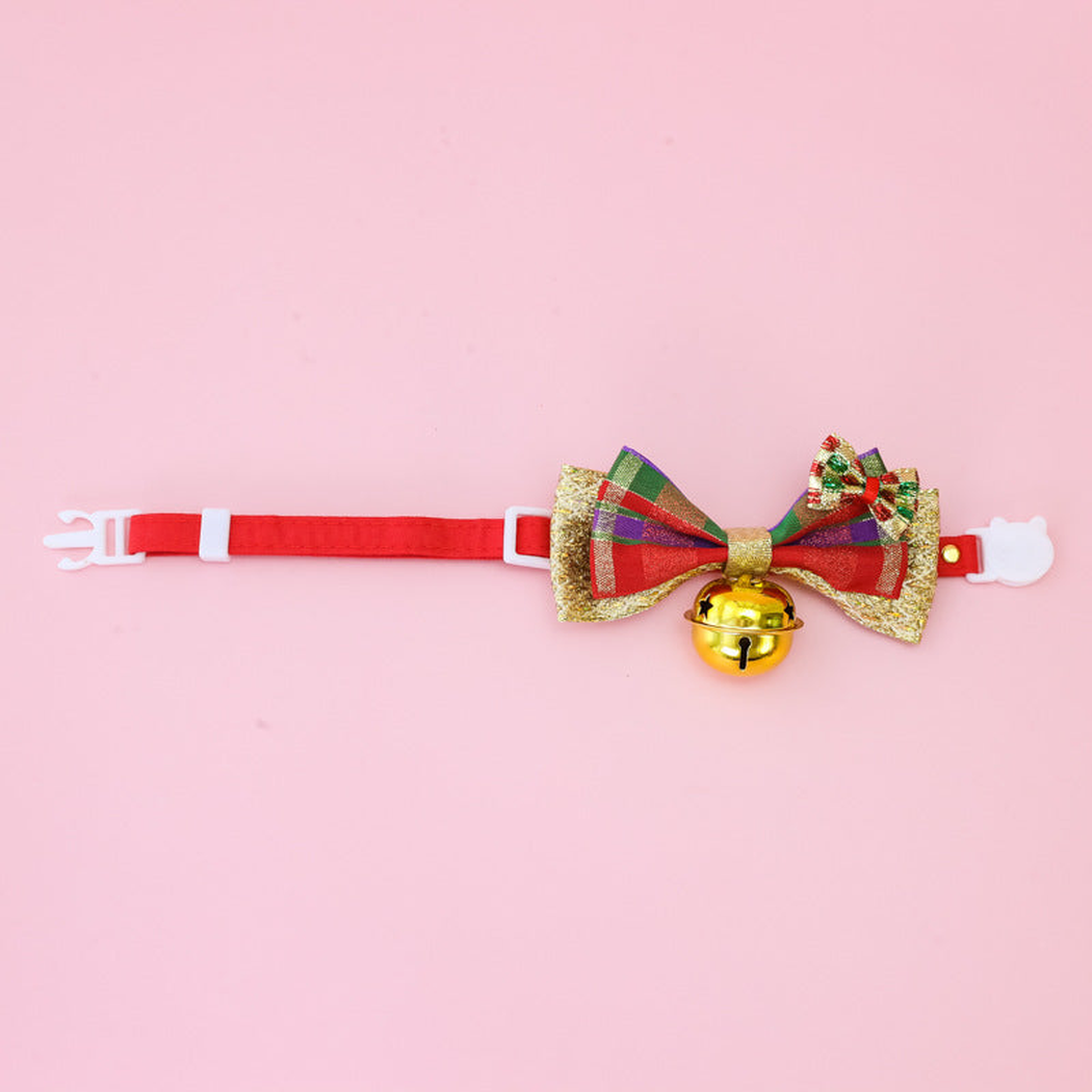 Red pet collar with a plaid bow and gold-tone bell, full strap view