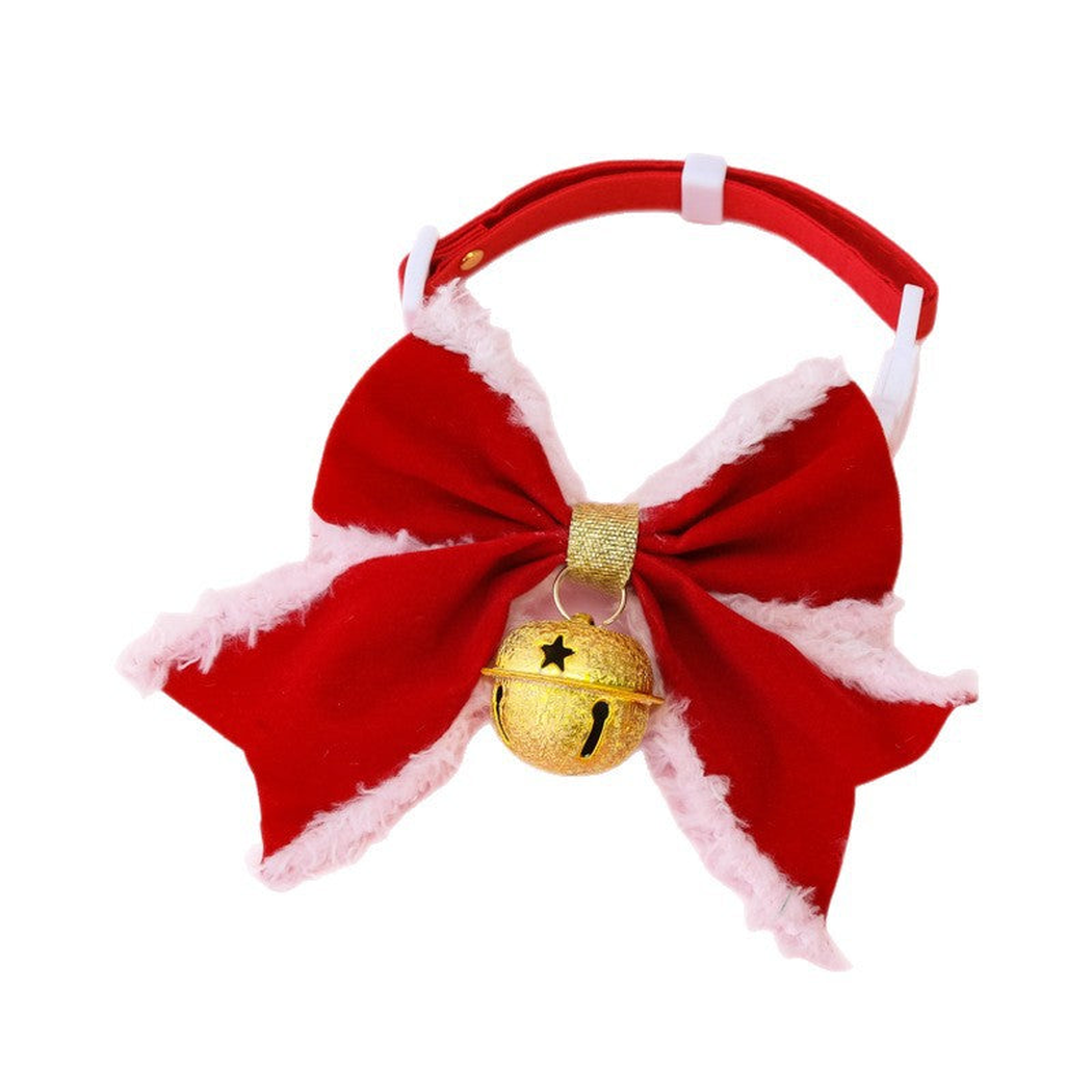 Red bow pet collar with white buckle and hanging frosted bell on a white background
