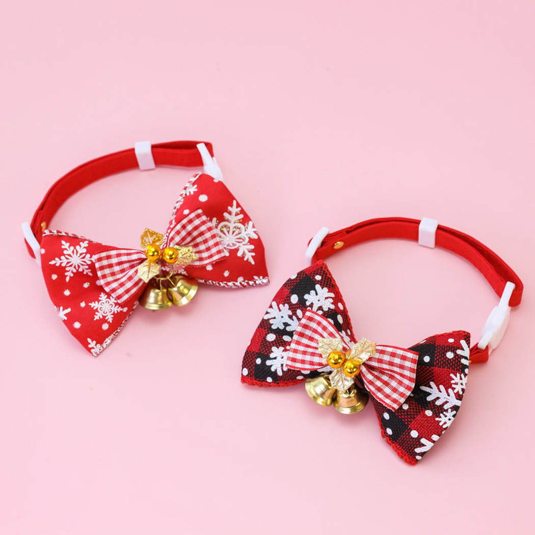 Red Plaid and Black Plaid pet collars with bows and bells displayed together