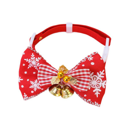 Red pet collar with a snowflake-patterned bow and gold bells, front view